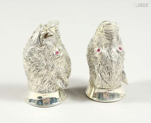 A PAIR OF .925 SILVER PLATED BOAR'S HEAD SALT AND PEPPERS