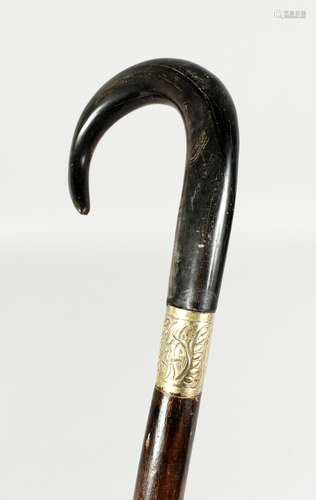 A LARGE VICTORIAN WALKING STICK with crook handle, possibly ...