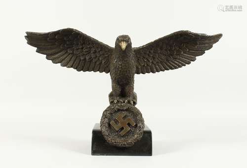 A BRONZE NATIVE EAGLE on a marble base. 17ins wide.