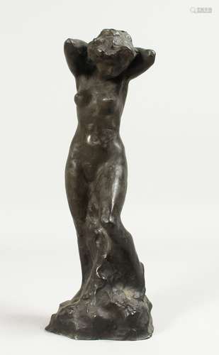 A BRONZE STANDING NUDE. 12ins high.