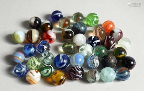 A COLLECTION OF FORTY VARIOUS COLOURED MARBLES 1-1.5cm