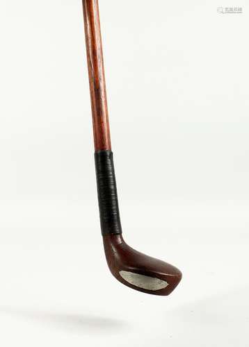 A SMALL WALKING STICK, the handle as a golf club. 32ins long...