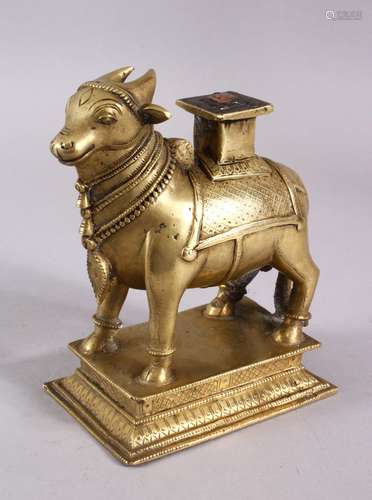 A 19TH CENTURY SOUTH INDIAN BRASS FIGURE OF NANDI BULL, 17cm...