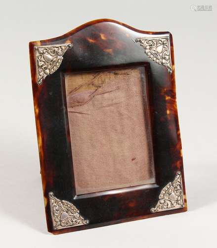 A SILVER MOUNTED UPRIGHT TORTOISESHELL PHOTOGRAPH FRAME with...