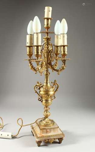 A 19TH CENTURY ONYX AND GILT METAL FIVE LIGHT CANDLELABRA on...