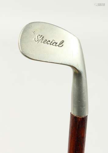 A SMALL WALKING STICK, the handle as a special metal golf cl...