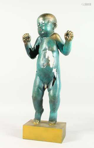 AN ABSTRACT BRONZE BROKEN STANDING BABY on a gilt metal base...