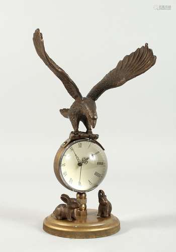 A BRONZE EAGLE BALL CLOCK 8ins high.