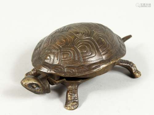 A BRONZE TORTOISESHELL BOWL. 6ins long.