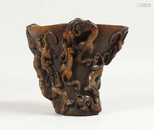 A CHINESE CARVED HORN LIBATION CUP. 5ins high.