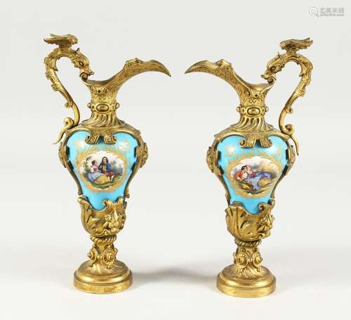 A GOOD PAIR OF SILVER GILT BRONZE AND PORCELAIN EWERS with a...