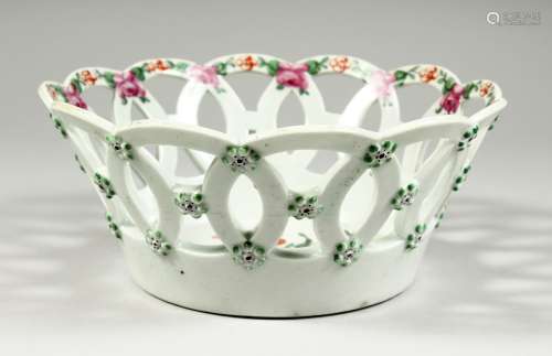 A WORCESTER BASKET, the centre painted with a large bouquet ...