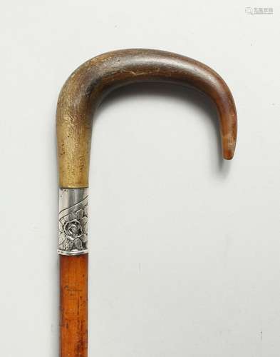 A VICTORIAN WALKING STICK with rhino crook handle and .800 s...