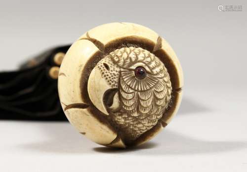 A VICTORIAN UMBRELLA with carved ivory parrot handle.