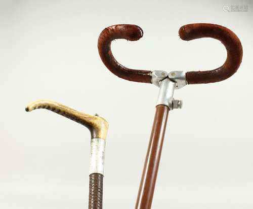 A SWAIN-BRIGG SHOOTING STICK and a bone handled whip.(2). 34...