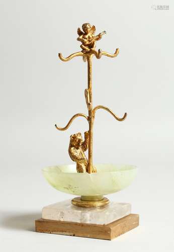 A JADE , CRYSTAL AND GILDED BEAR RING STAND on a square base...