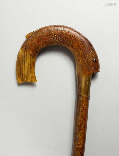 A VICTORIAN WALKING STICK with carved horn handle in the sha...