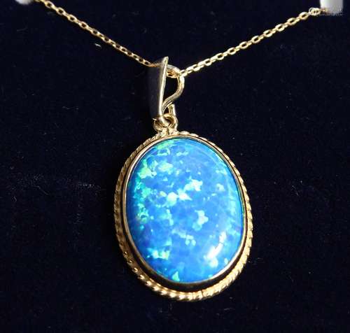 A 9CT. GOLD OPAL PENDANT AND CHAIN