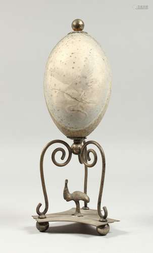 AN AUSTRALIAN EMU EGG with plated mount and wooden base, etc...