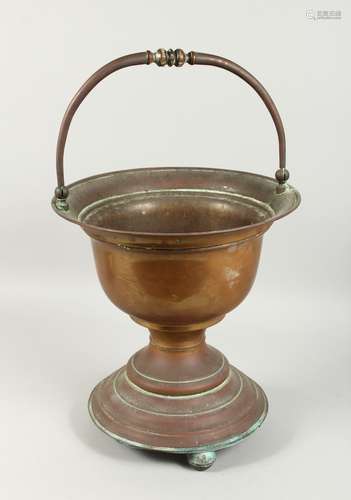 A DUTCH COPPER JARDINIERE with swing handle. 1ft 3ins high