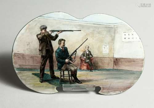 A RARE SHAPED ENAMEL SHOOTING TARGET PRACTICE PLAQUE Two men...