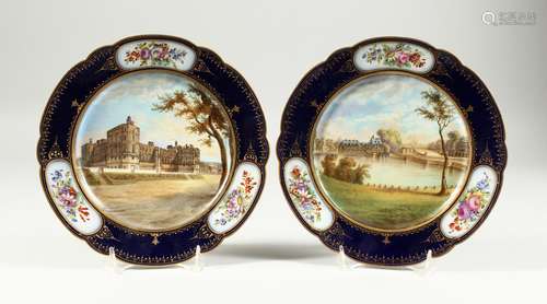 A SUPERB PAIR OF SEVRES PORCELAIN PLATES, the blue borders w...