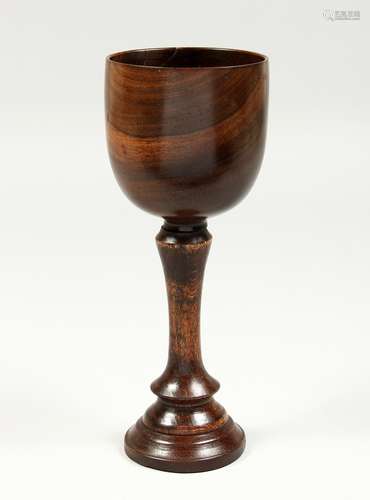 A GOOD TURNED WOOD GOBLET 11.5ins high