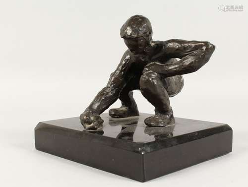 JUGANDO CANICAS (MEXICAN) A BRONZE CROUCHING MAN. Signed, on...