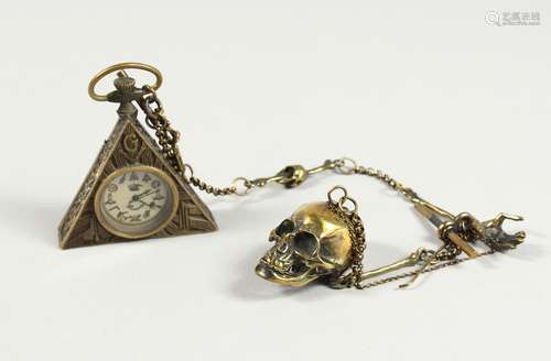 A BRASS MASONIC WATCH AND SKULL on a chain