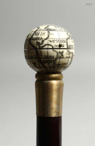 A BONE WALKING STICK ' GLOBE AND COMPASS'