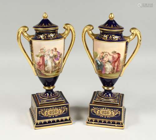A GOOD PAIR OF VIENNA PORCELAIN TWO HANDLED URNS ON STANDS, ...