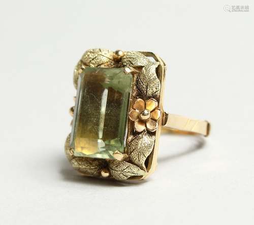 A GOOD GOLD PERIDOT RING