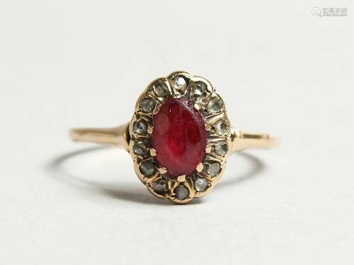 AN 18CT GOLD, RUBY AND DIAMOND CLUSTER RING