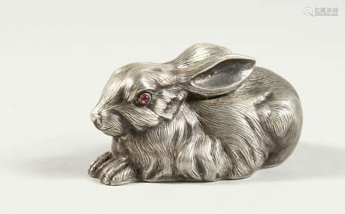 A SMALL RUSSIAN SILVER RABBIT with ruby eyes, stamped head, ...