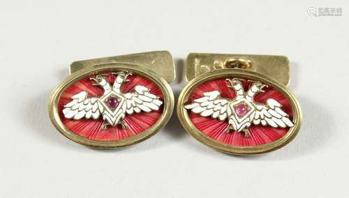 A PAIR OF RUSSIAN AND ENAMEL CUFF LINKS with Faberge mark.