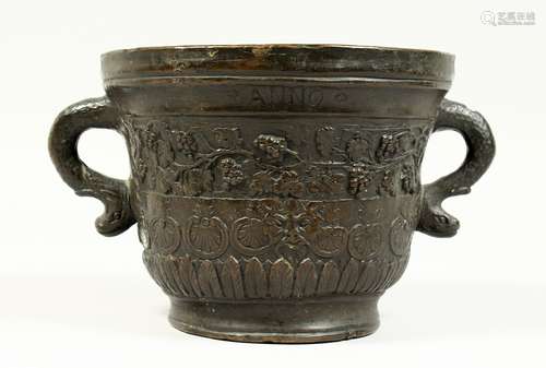 A TWO HANDLED BRONZE MORTAR, with serpent handles, the body ...