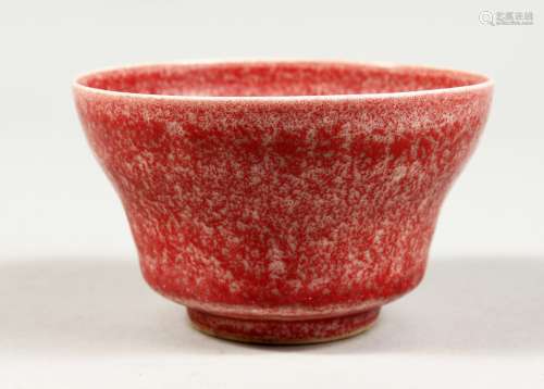 A SMALL CHINESE SPECKLED RED PORCELAIN BOWL. 3.5ins diameter...