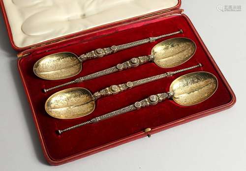 A SET OF FOUR EDWARD VII SILVER GILT APOSTLE SPOONS 10ins lo...