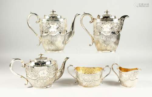 A VICTORIAN SILVER FIVE PIECE TEA SET a with scroll and repo...