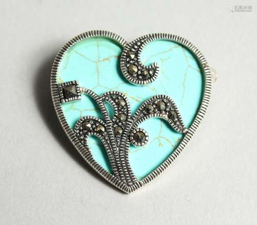 A TURQUOISE HEART SHAPED BROOCH