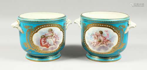 A LARGE PAIR OF SEVRES CIRCULAR BLUE GROUND COOLERS edged in...