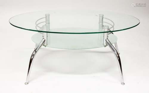 A MODERN GLASS AND CHROME TWO TIER OVAL COFFEE TABLE. 3ft 7i...