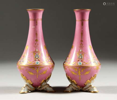 A SMALL PAIR OF SEVRES PINK GROUND VASES with gilt and pierc...