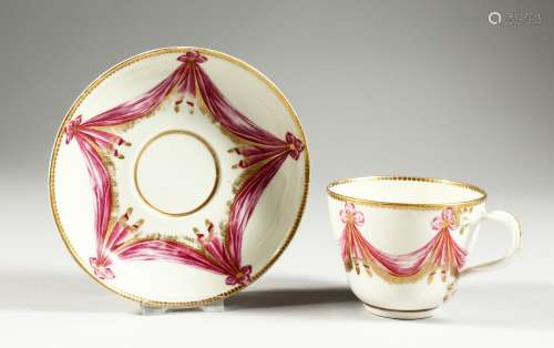 A WORCESTER RARE TEACUP AND SAUCER, the cup with entwined ha...