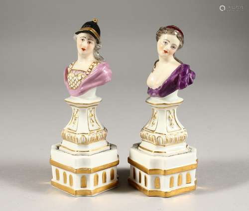 A GOOD SMALL PAIR OF DRESDEN BUSTS ON FIXED STANDS, of a man...