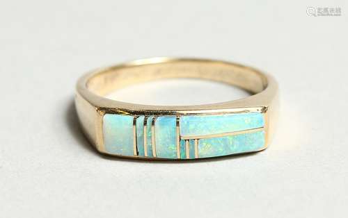 A GOLD OPAL SET RING