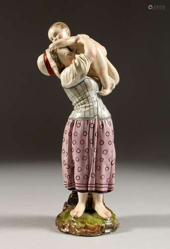 A GOOD HOCHST POTTERY FIGURE OF A MOTHER AND CHILD. Hochst M...