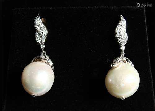 A PAIR OF BAROQUE PEARL EAR RINGS