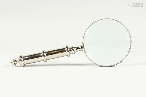 A MAGNIFYING GLASS WITH CHROME HANDLE