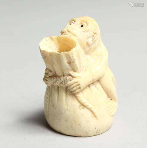 A CARVED BONE MONKEY VASE 2ins high